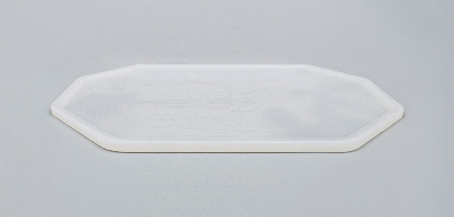 Close-up of colourless, translucent silicone placemat for cat dinnerware – view from above at an angle