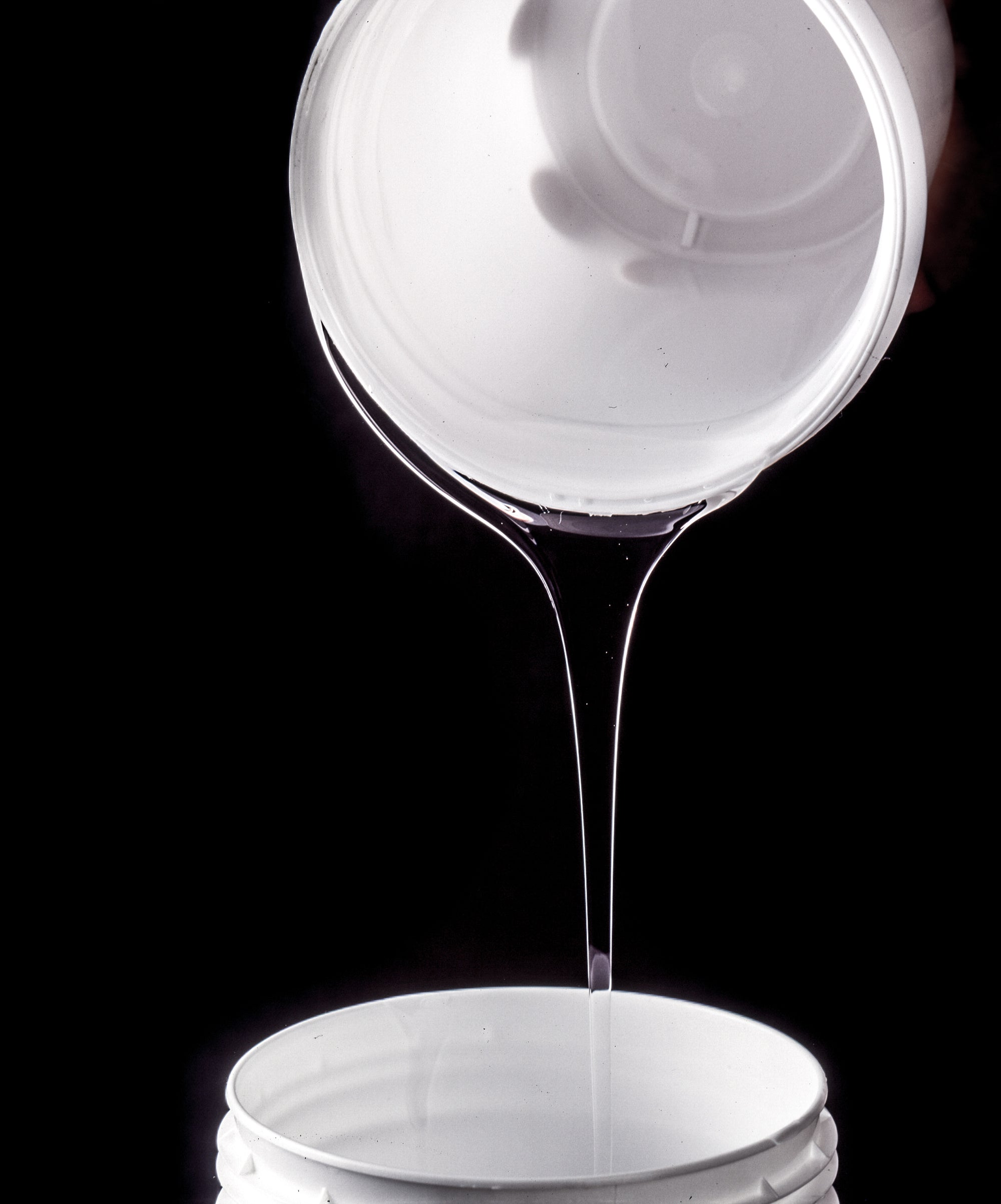 Liquid multi-component silicone rubber is filled by hand for casting