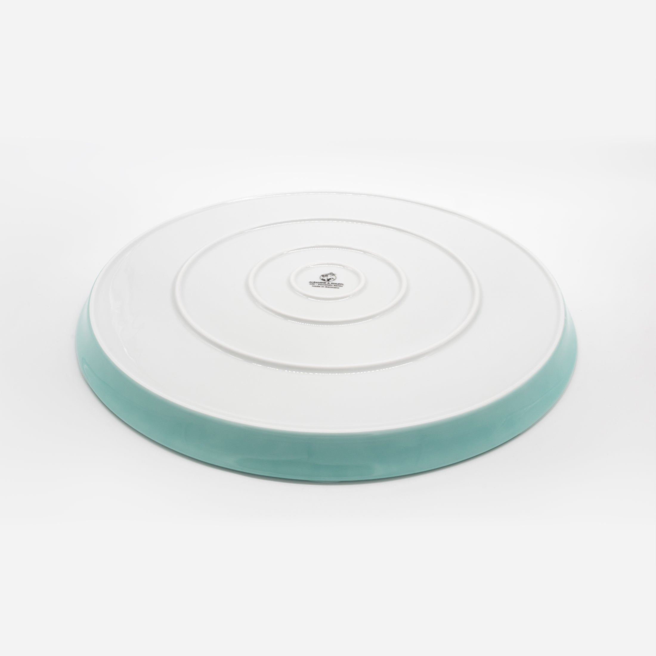 Rückseite Katzenteller türkis aus Porzellan in Größe 42 cm mit Füßen – Ansicht von schräg oben (Jungle Dawn)